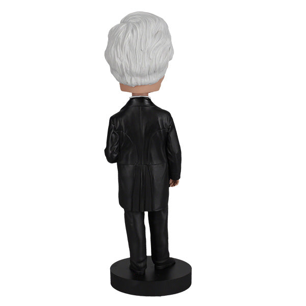 Millard Fillmore bobblehead featuring intricate details and traditional attire, perfect for collectors and history enthusiasts, displayed in a home setting.