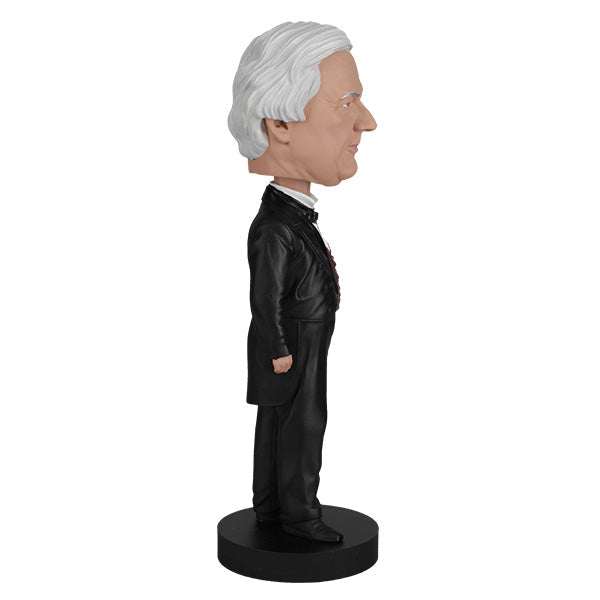 Millard Fillmore bobblehead featuring intricate details and traditional attire, perfect for collectors and history enthusiasts, displayed in a home setting.