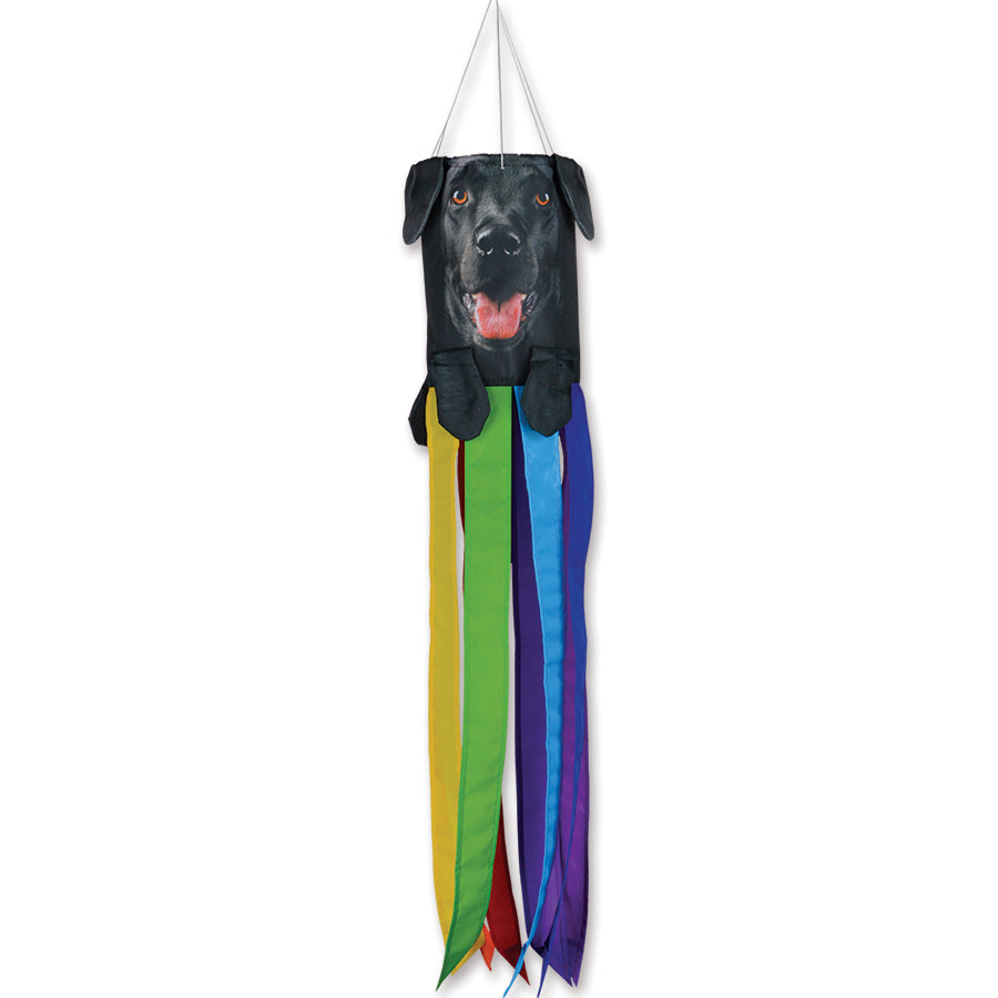 Mini Pet Windsock featuring a smiling Black Labrador Retriever with distinct ears and paws, displayed outdoors in a garden setting.