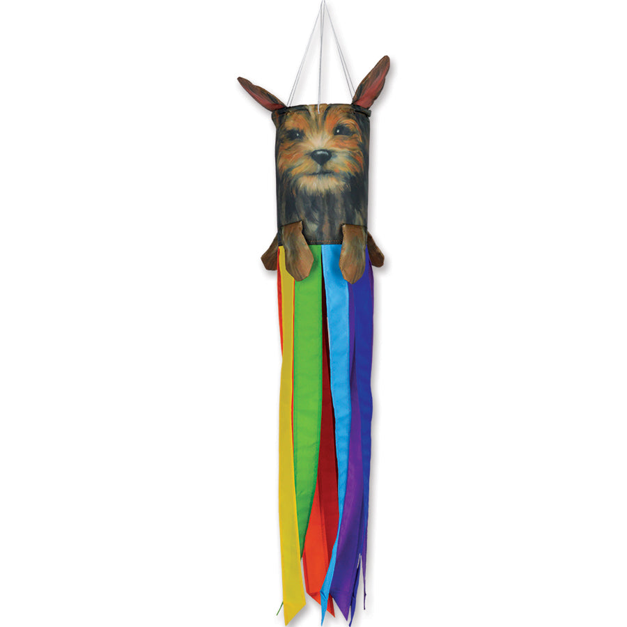 Mini Pet Windsock featuring a cheerful Yorkshire Terrier design with floppy ears and a wagging tail hanging in an outdoor garden space.