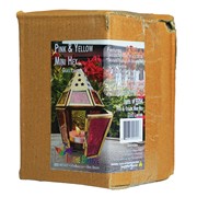 Mini Pink & Yellow Hex Glass Tealight Lantern featuring colorful stamped glass panels and a brass metal frame, displayed on a table illuminated by a candle.