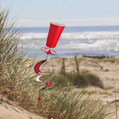 Mini Red Cup 5 O'Clock Drink Spinner featuring a vibrant solo cup design, spinning in the breeze, creating a cheerful outdoor atmosphere.