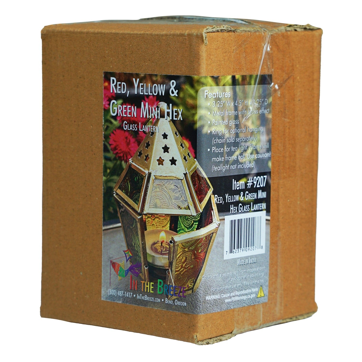 Mini Red, Yellow & Green Hex Glass Tealight Lantern showcasing vibrant colors with intricate metal accents, designed for tealights, hanging in an outdoor setting.