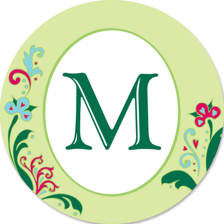 Monogram Triple Spinner - M in a vibrant design spinning gracefully in an outdoor garden setting, showcasing personalized decor.