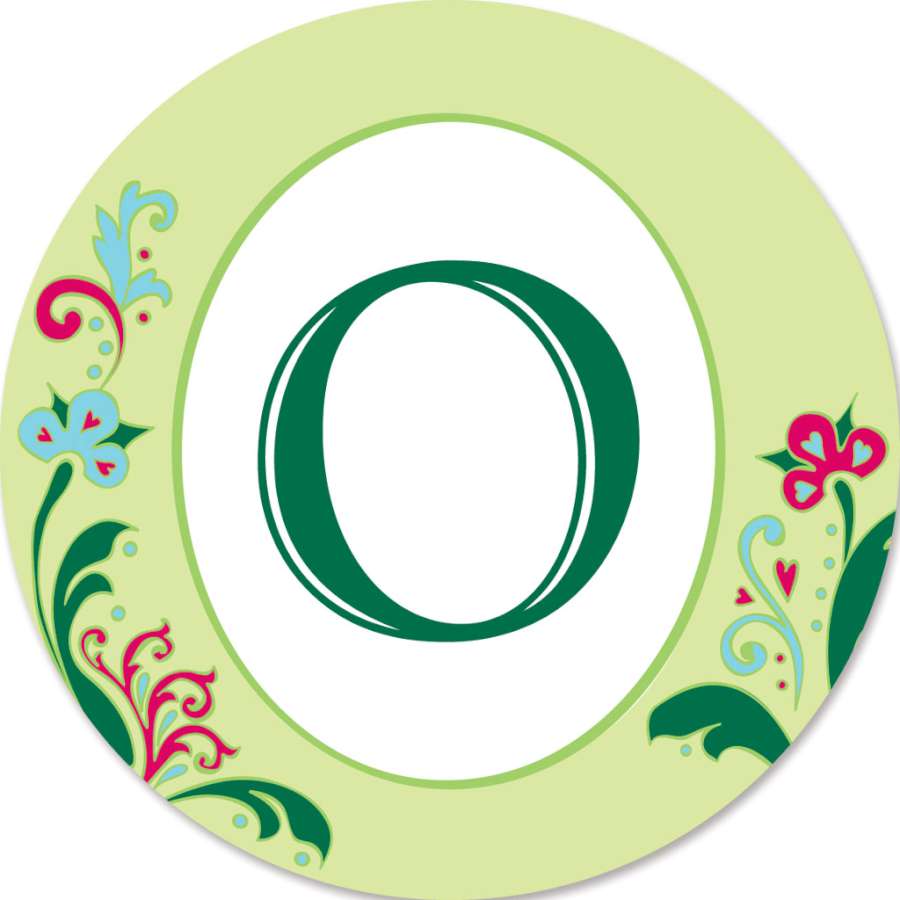 Monogram Triple Spinner - O displaying vibrant colors and a unique design in a garden setting, with motion against the background.