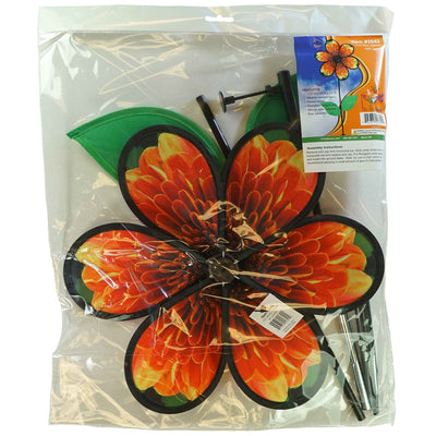 13.5-inch Mum Spinner with Leaves featuring realistic chrysanthemum petals and green leaves, spinning in a garden setting.