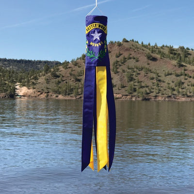 Nevada 18 inch windsock showcasing the state flag with vibrant colors and fluttering tails in a garden setting, celebrating state pride.