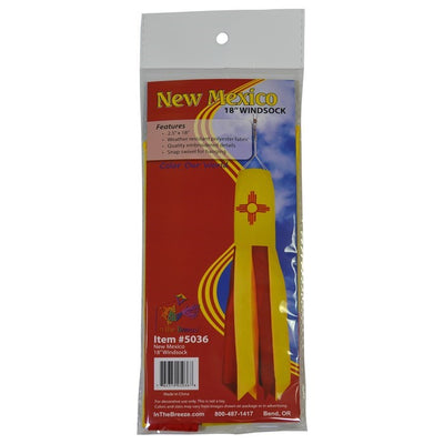 New Mexico 18-inch windsock featuring Zia design with colorful applique and embroidered accents, fluttering in the breeze outdoors.