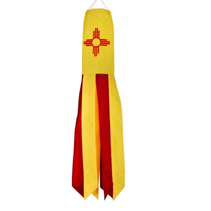 New Mexico 18-inch windsock featuring Zia design with colorful applique and embroidered accents, fluttering in the breeze outdoors.