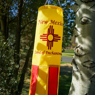 New Mexico 40 inch windsock displaying colorful appliqued graphics and fluttering tails against a backdrop of blue sky.