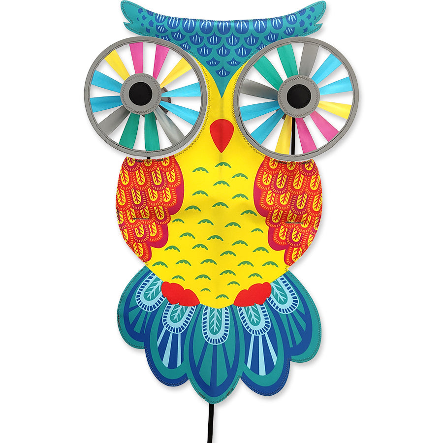 Night Owl Reflective Eyes Spinner with rotating reflective eyes placed on a garden pole, adding whimsical charm to the outdoor space.