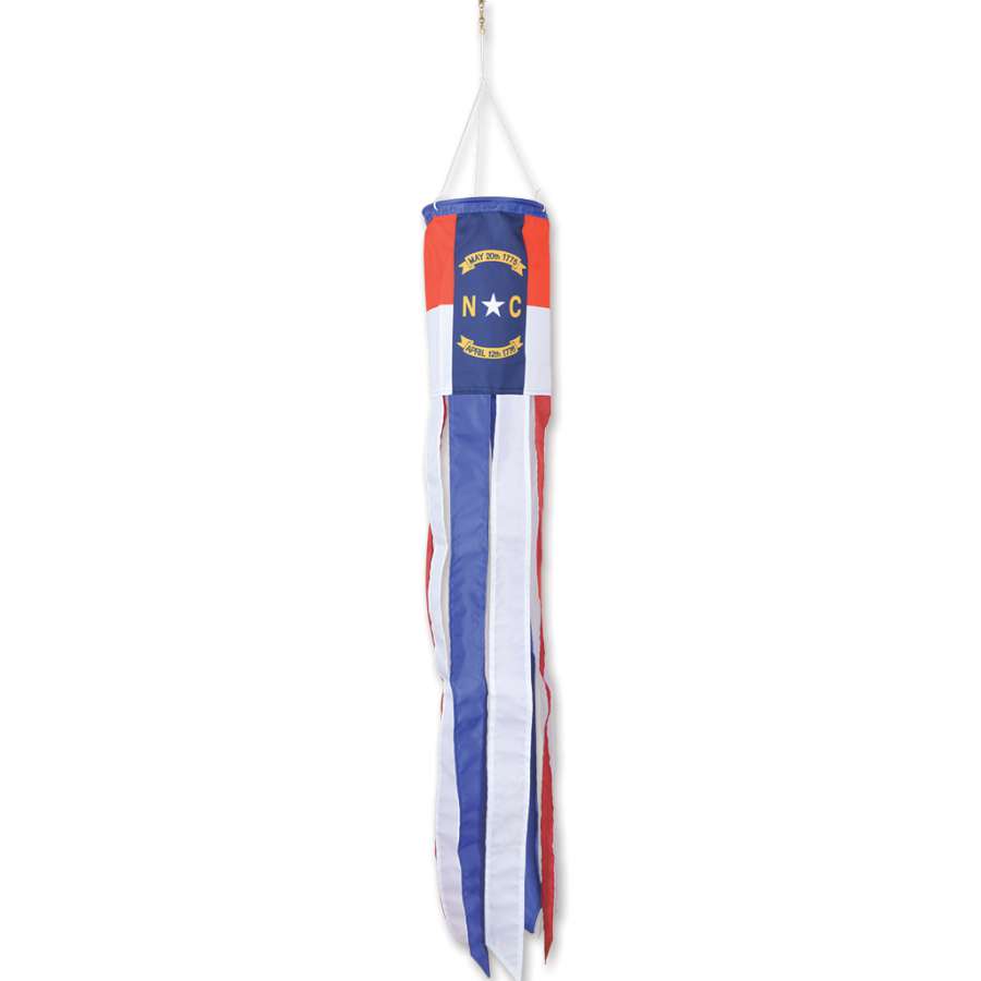 North Carolina windsock displaying bright colors and traditional design, hanging outdoors in a garden setting, showcasing state pride.
