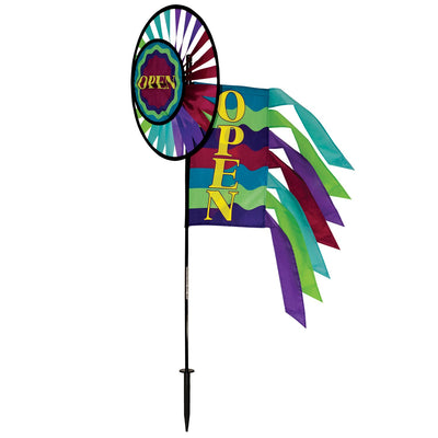 Open Spinner Wheel with Garden Flag & Tails displaying 'Open for Business' in vivid colors, rotating in a gentle breeze at an outdoor location.