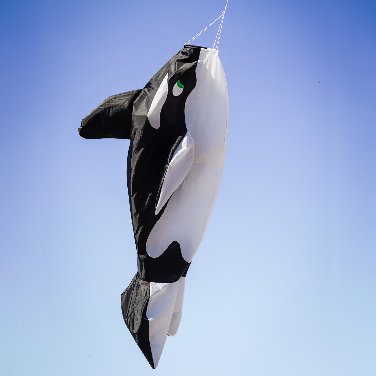 Orca Big Breeze WindsockTM featuring a vibrant 3D design of an orca whale, inflating in the wind and hanging in a sunny outdoor setting.
