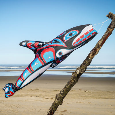 Orca Totem 48" Fish Windsock featuring intricate indigenous design, displayed in an outdoor setting, moving with the breeze.