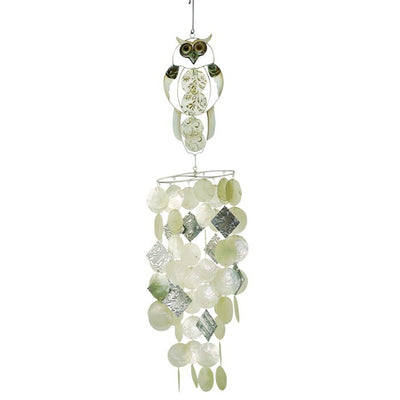 Owl Capiz Breeze Wind Chime made of handcrafted Capiz shells and textured metal displayed on a garden hook in a serene outdoor setting.