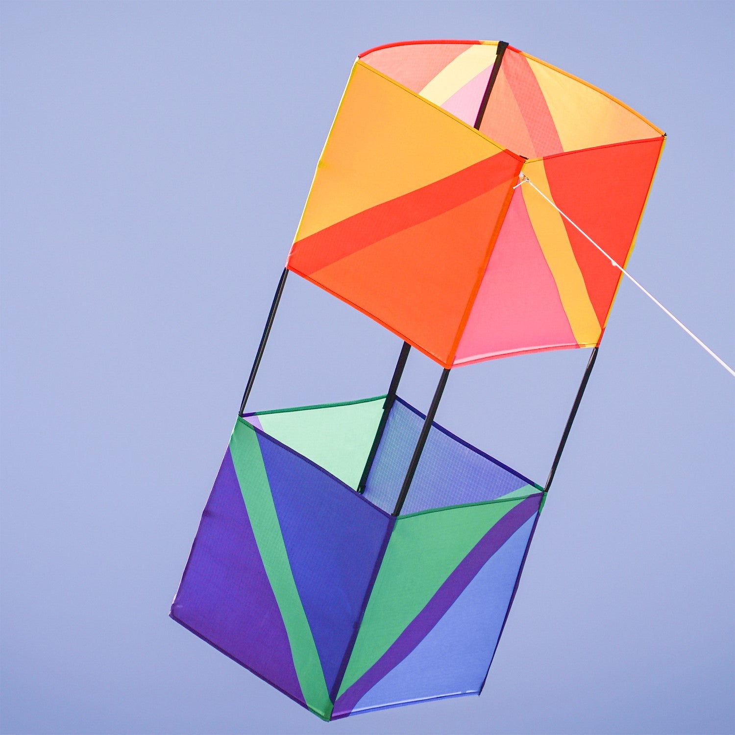 Pacific Double Box Kite showing vibrant design in outdoor setting, illustrating its stable flight and weather-resistant fabric construction.