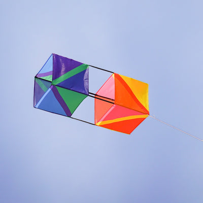 Pacific Double Box Kite showing vibrant design in outdoor setting, illustrating its stable flight and weather-resistant fabric construction.