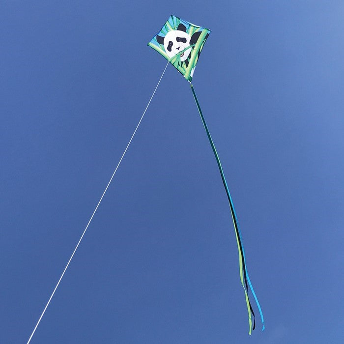 Panda 30" Diamond Kite flying high in a clear blue sky, showcasing its vibrant panda bear design and colorful tails, perfect for outdoor fun.