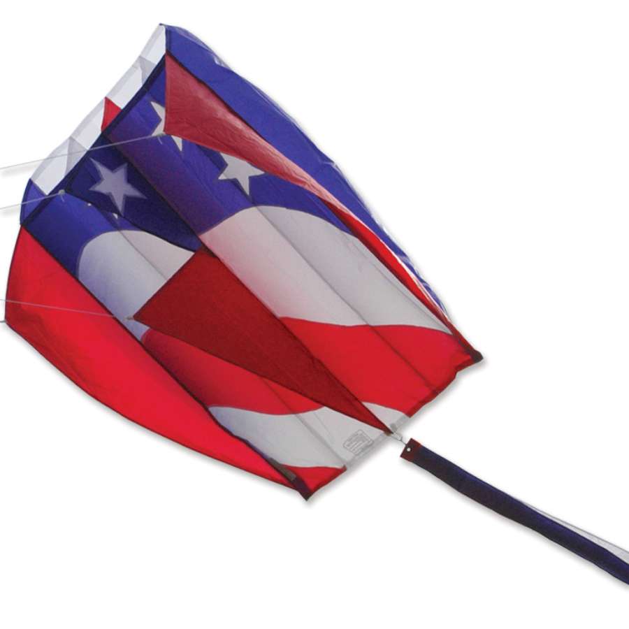 Parafoil 5 Kite in patriotic colors soaring through a bright blue sky, showcasing its vibrant design while being flown outdoors.