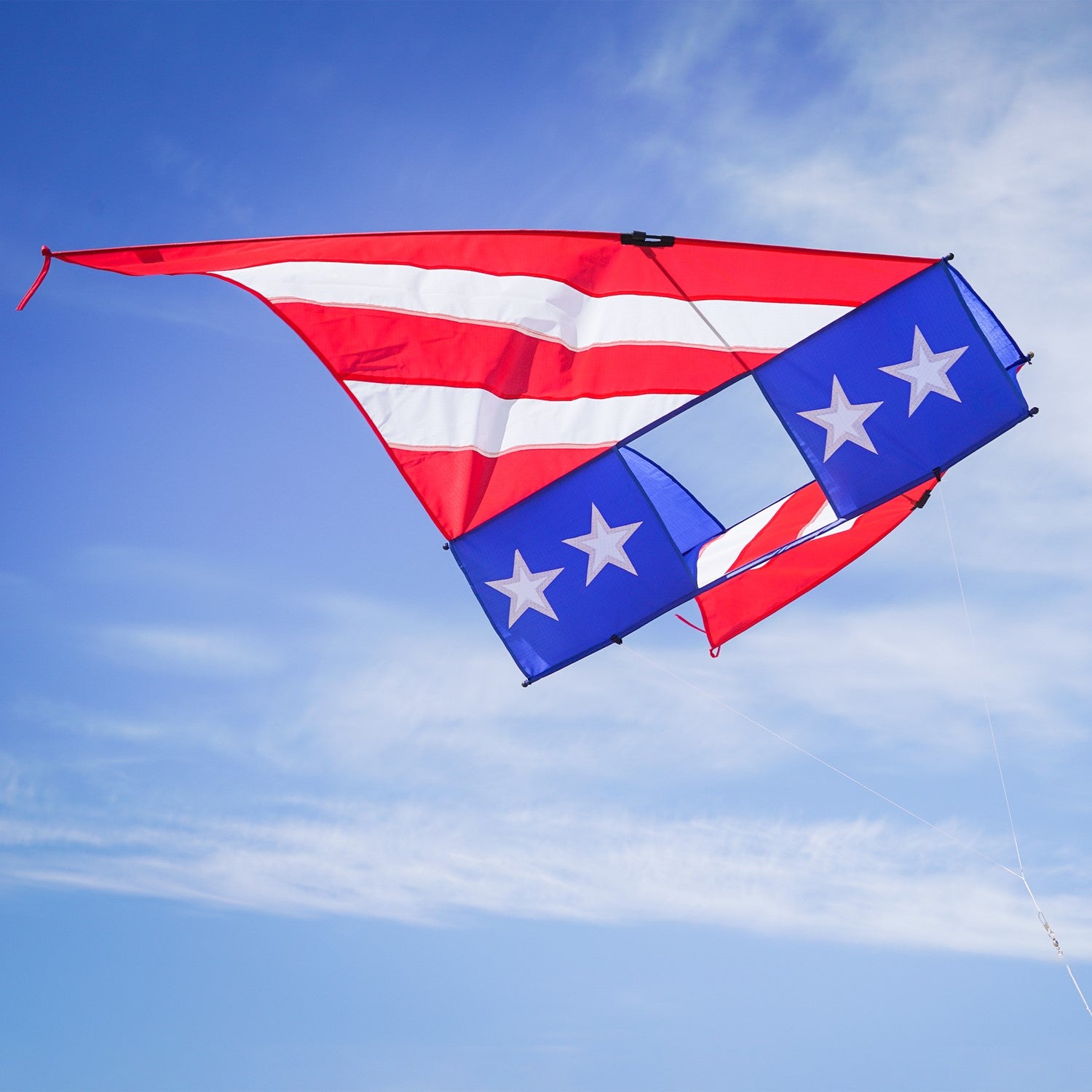 Patriot 6' Conyne Delta Kite soaring in the sky, showcasing vibrant red, white, and blue colors, perfect for family fun and outdoor celebrations.