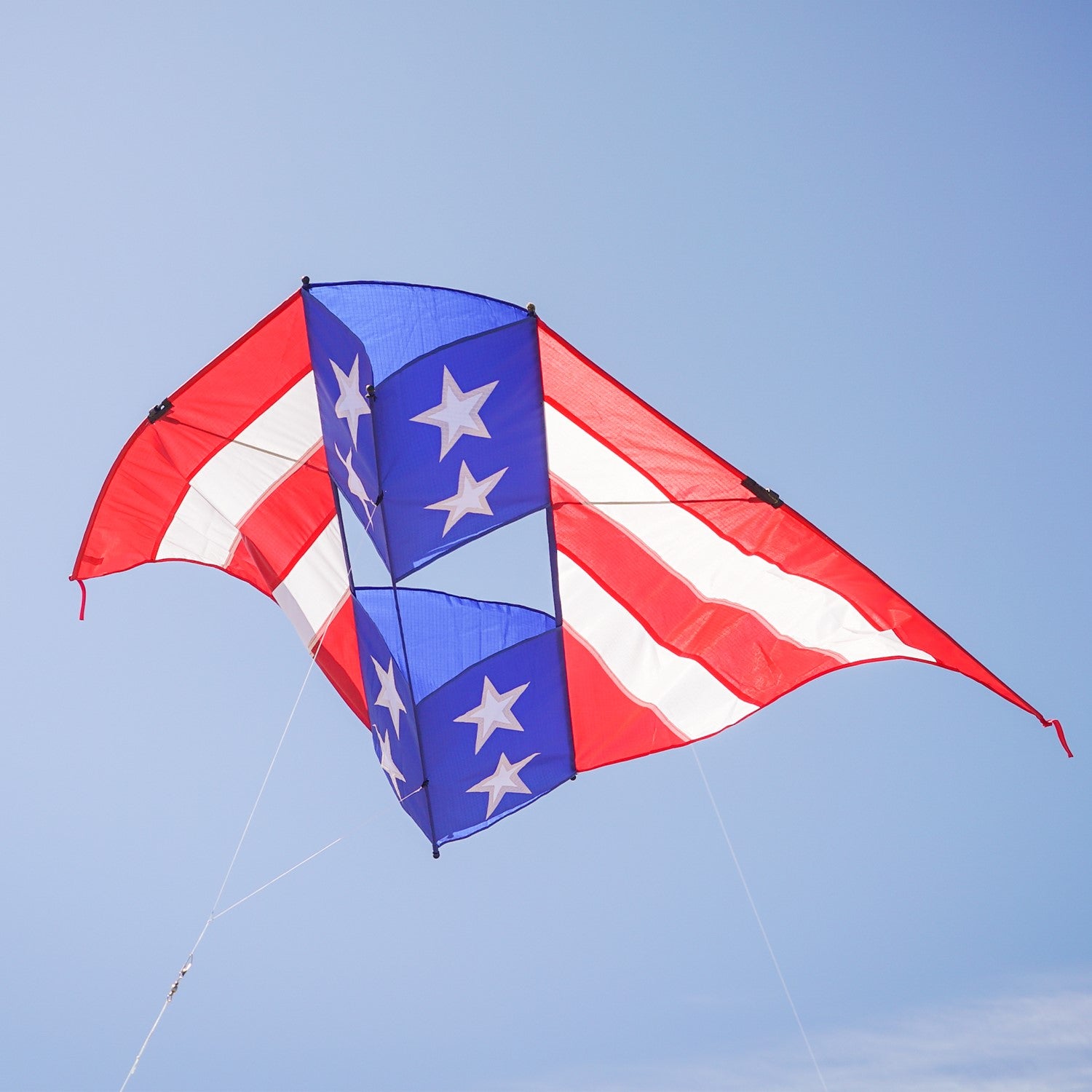 Patriot 6' Conyne Delta Kite soaring in the sky, showcasing vibrant red, white, and blue colors, perfect for family fun and outdoor celebrations.