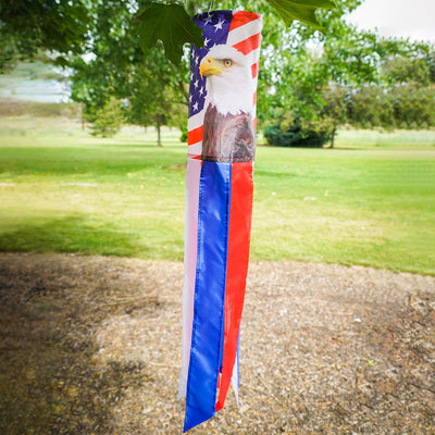 Patriot Eagle 30\" Windsock showcasing a vibrant bald eagle and stars and stripes design hanging in a garden setting.