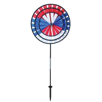 Patriot Triple Wheel Spinner featuring red, white, and blue wheels spinning in the breeze, set on a decorative garden stake.