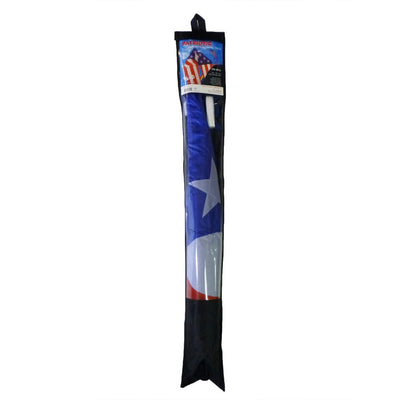 Patriotic 56" Delta kite featuring red, white, and blue stars and stripes with long tails, soaring in bright blue sky against a backdrop of fluffy clouds.
