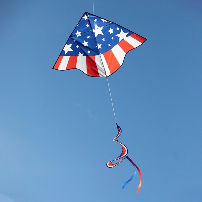 The Patriotic Star Delta with Spinning Tail showcases a bold red, white, and blue design that captures the essence of patriotism while flying effortlessly in the sky.