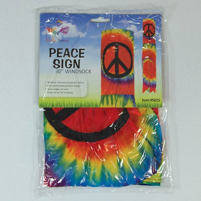 Vibrant Peace Sign 30" windsock displaying colorful tie-dye design with six tails, fluttering in the breeze in an outdoor setting.