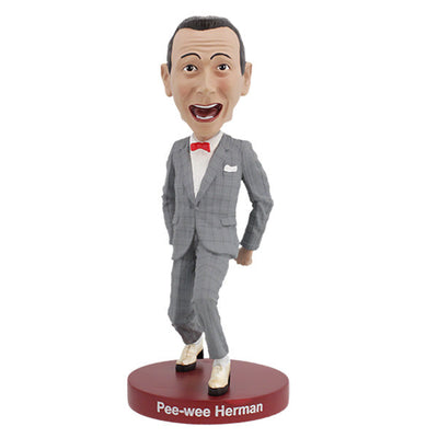 Pee-Wee Herman Bobblehead, standing 7 inches tall in a gray suit and red bowtie, featuring a playful expression, displayed on a decorative shelf.
