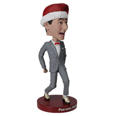 Pee-Wee Herman Holiday Bobblehead featuring the character in a gray suit and red bowtie, standing approximately 7 inches tall on a display surface.