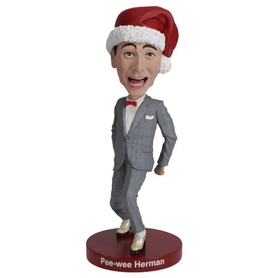 Pee-Wee Herman Holiday Bobblehead featuring the character in a gray suit and red bowtie, standing approximately 7 inches tall on a display surface.