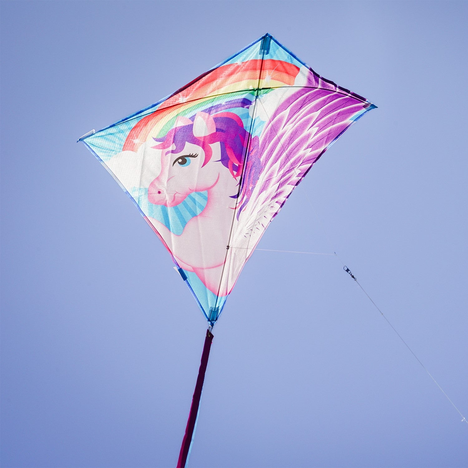 Pegasus 30" Diamond Kite displayed soaring in a clear sky, showcasing colorful designs and attached tails, ideal for outdoor enjoyment.