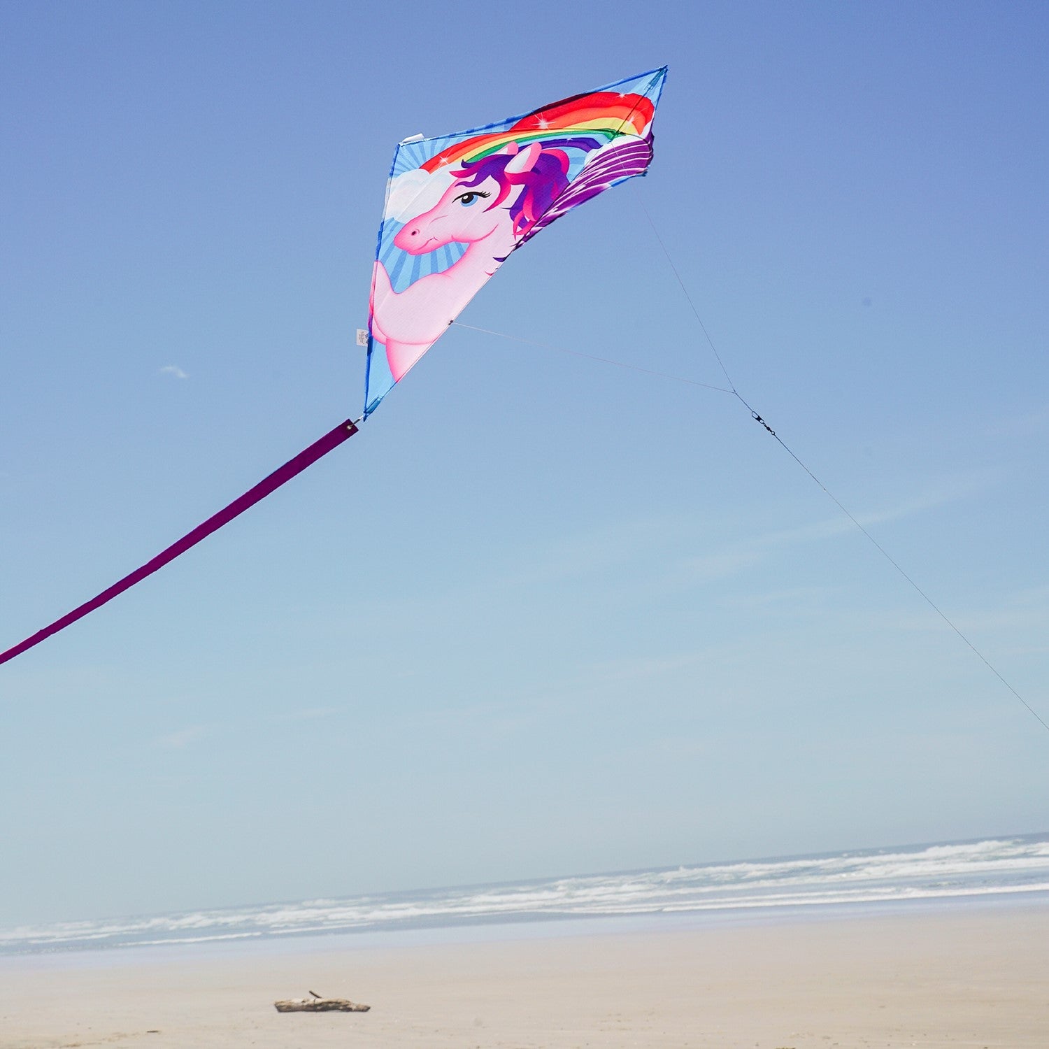 Pegasus 30" Diamond Kite displayed soaring in a clear sky, showcasing colorful designs and attached tails, ideal for outdoor enjoyment.