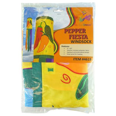 A colorful Pepper Fiesta 40" windsock featuring cheerful chili peppers and fluttering tails hanging gracefully in an outdoor garden setting.