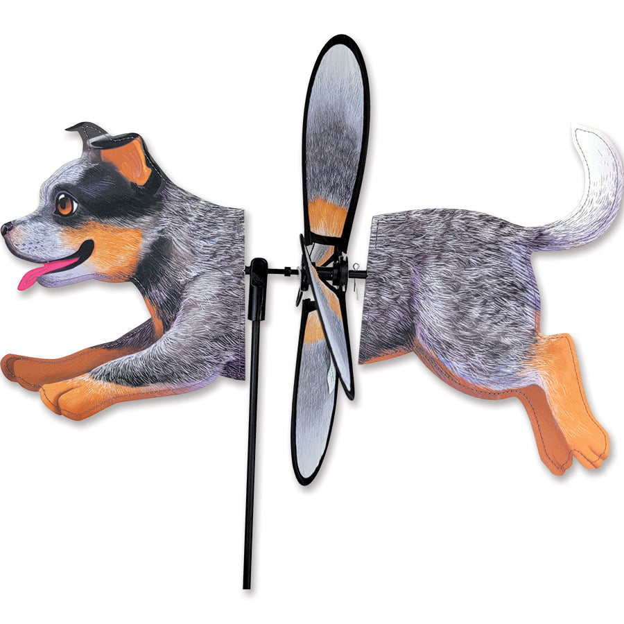 Petite Spinner featuring an Australian Cattle Dog design elegantly spinning in a garden setting, showcasing vibrant colors and charm.