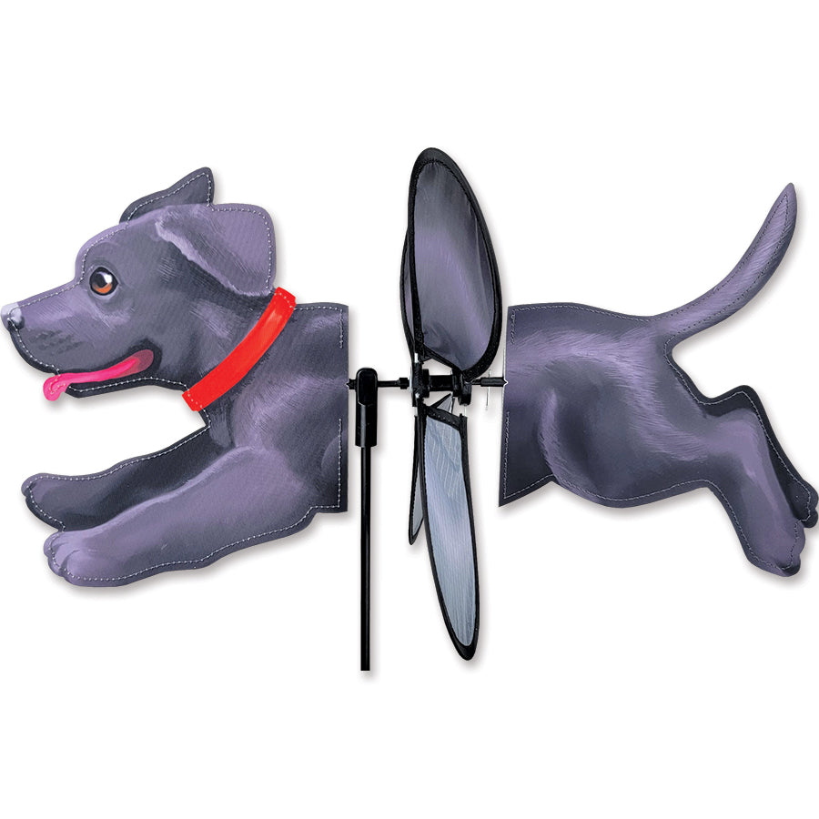 Petite Spinner - Black Lab features a spinning black lab design displayed in a vibrant garden setting, swaying gently in the breeze.