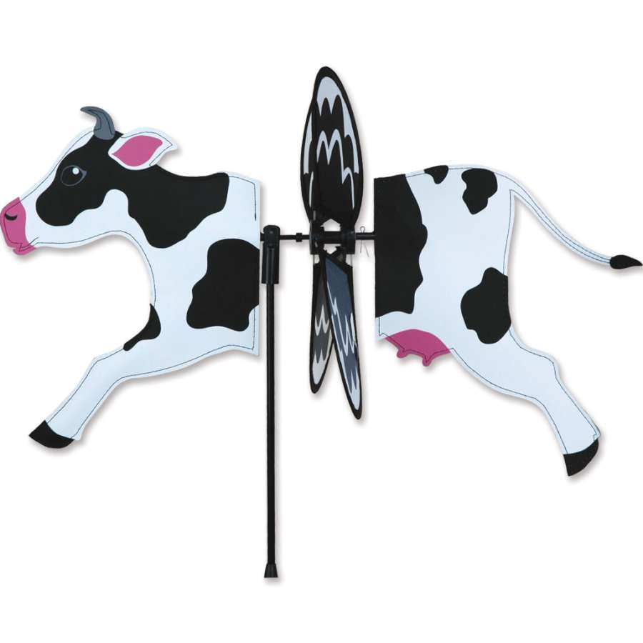 Colorful cow-themed Petite Spinner designed for outdoor display, showcasing lively spinning action in a garden setting.