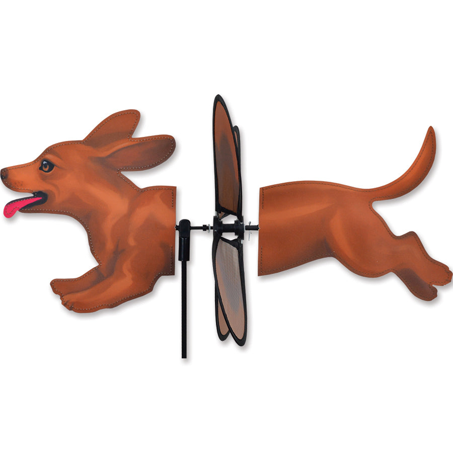 Petite Spinner featuring a colorful dachshund design spinning gently in a garden setting, showcasing its vibrant colors and durable construction.