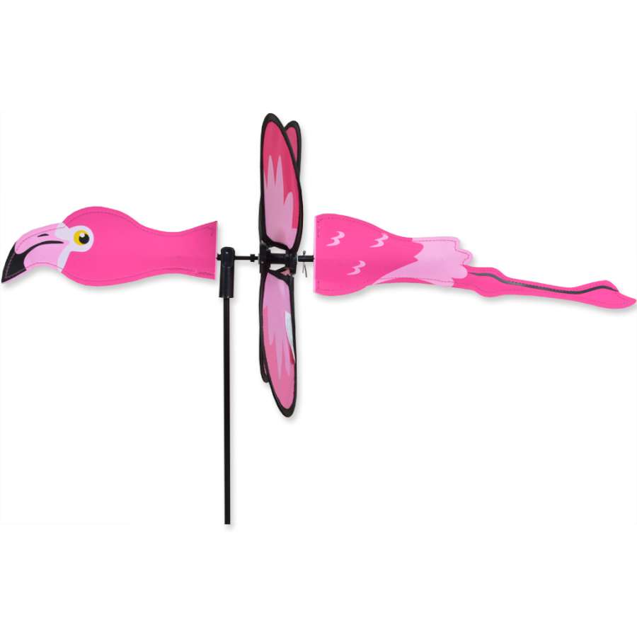 Petite Spinner - Flying Flamingo displaying vibrant colors and whimsical design, spinning in a gentle breeze amidst garden flowers.