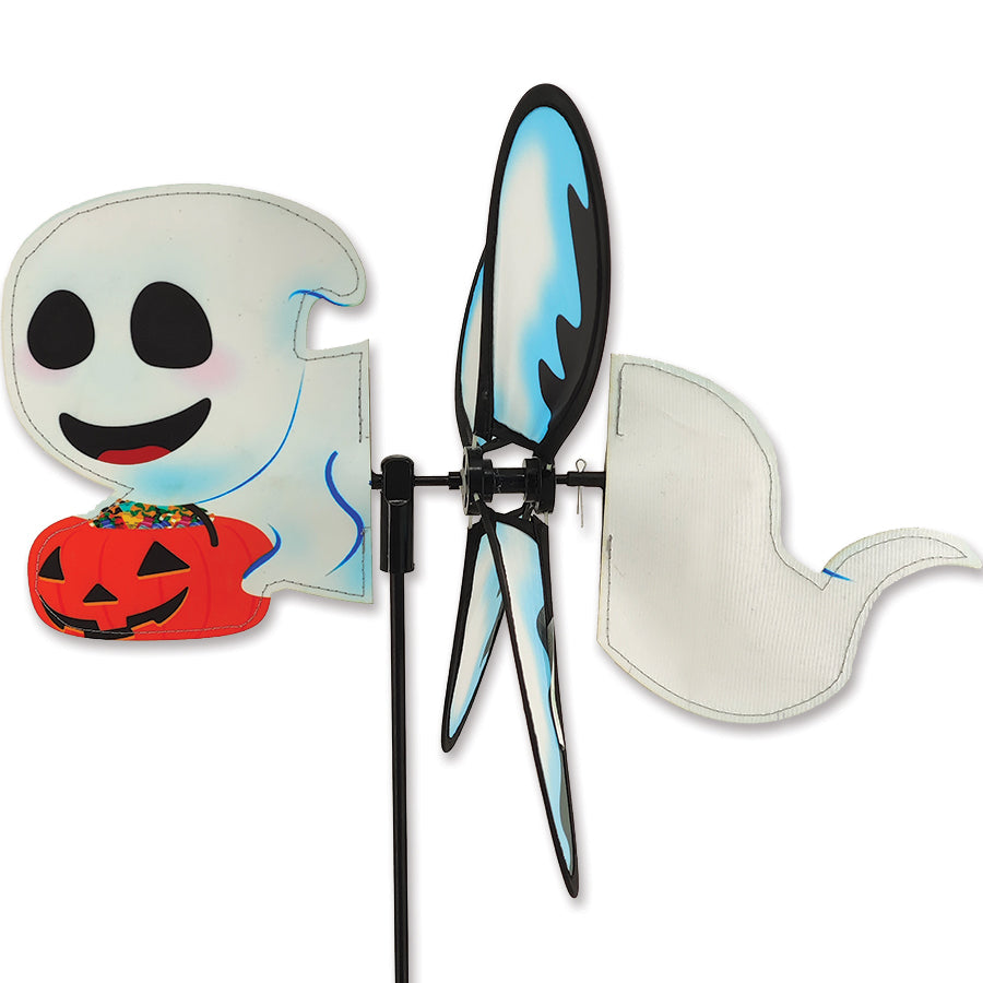 Petite Spinner featuring Ghost and Pumpkin design, measuring 14x12.75 inches, spinning gently in a garden setting during daylight.