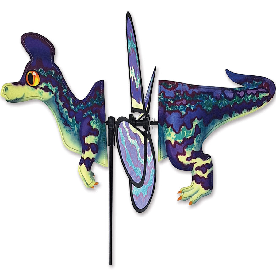 Petite Spinner featuring a Lambeosaurus design, beautifully colored, spinning in a garden setting with vibrant flowers around.