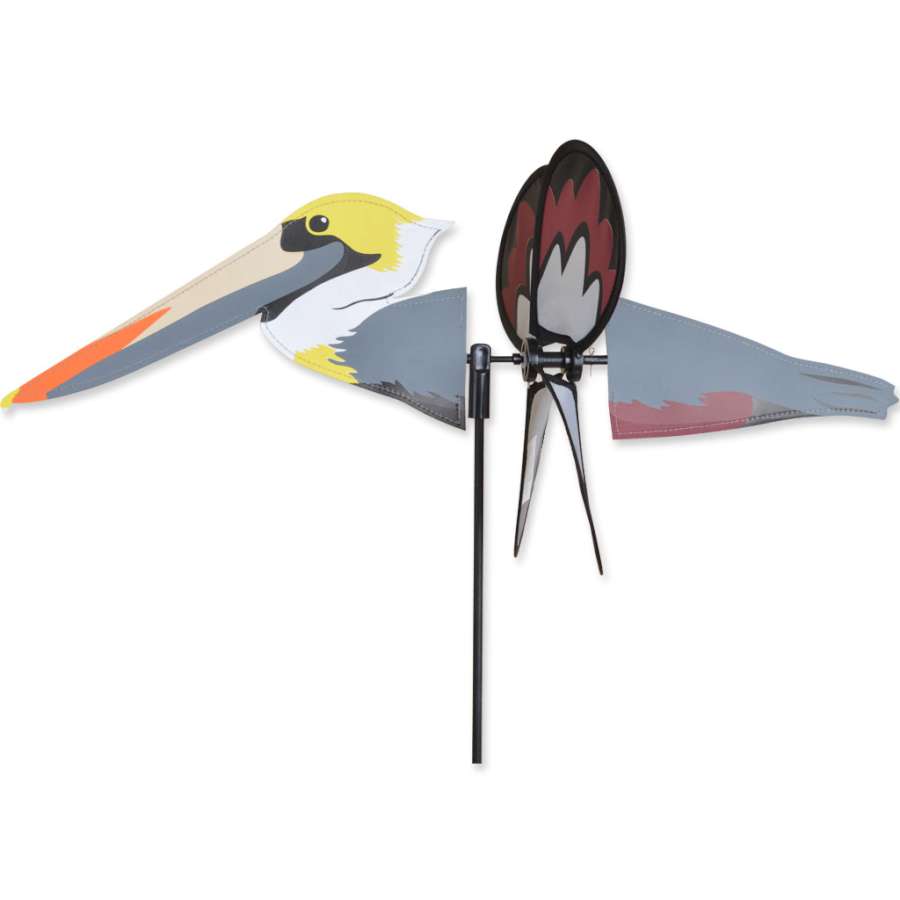 Petite Spinner - Pelican features a cute pelican design actively spinning in a garden setting, showcasing vibrant colors and durable construction.
