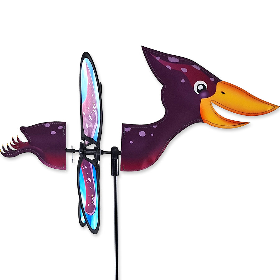 Petite Spinner - Pteranodon featuring colorful wings spinning in the garden under sunlight, creating a delightful outdoor atmosphere.