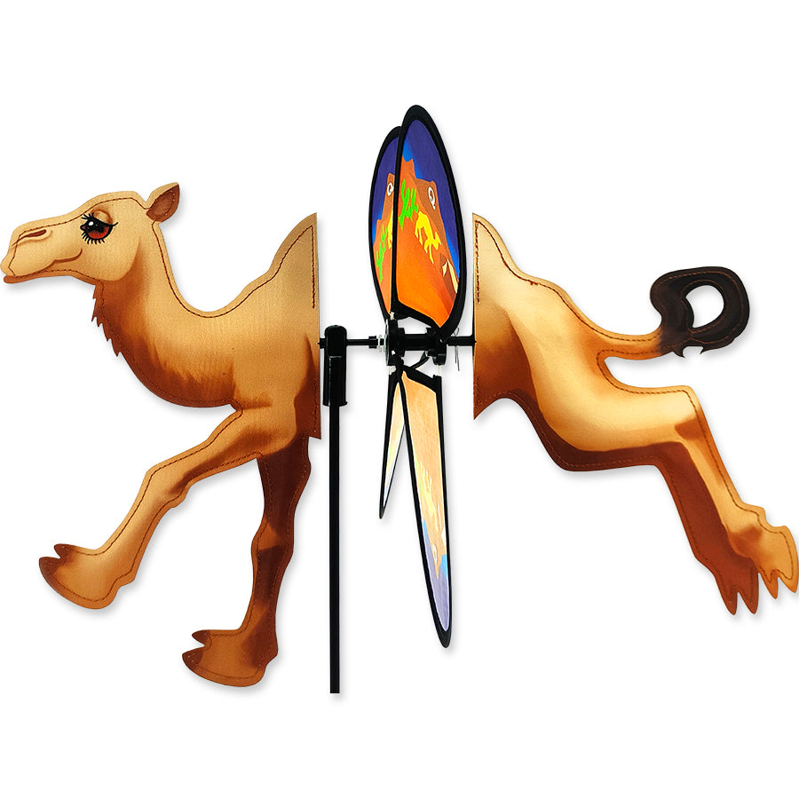Petite Spinner - Quartzsite Camel features colorful, spinning wings displayed in a garden setting, showcasing its delightful design.
