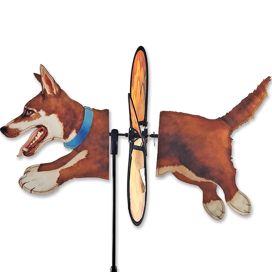 Petite Spinner featuring a Siberian Husky design, showcasing its vibrant colors and spinning motion in a garden setting.
