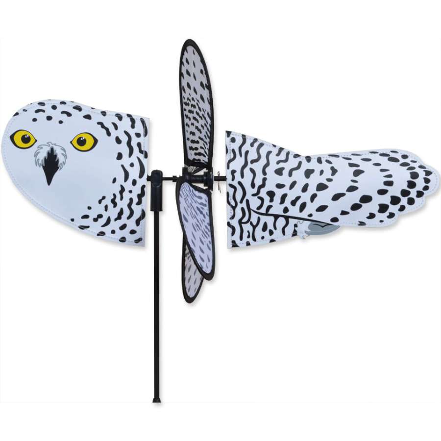 Petite Spinner featuring a charming snowy owl design twirling gracefully in an outdoor garden setting, perfect for adding whimsy.
