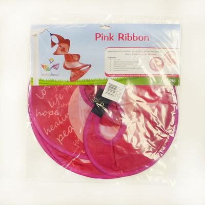 A Pink Ribbon Spin Duet hanging in a garden, featuring vibrant pink ribbon graphics and a spinning mechanism, symbolizing breast cancer awareness.